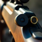 High-quality 32WIN cartridge with vintage rifle, highlighting precision and historical appeal.
